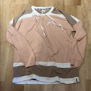 Victoria’s Secret pink sweatshirt.